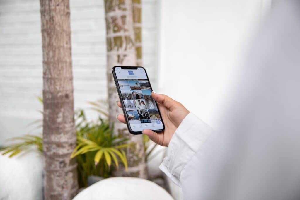A person browsing pictures in a smartphone.